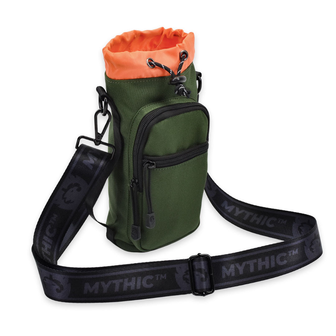 MYTHIC Logo Adjustable Shoulder Strap in black connected to Kelpie Bottle Sling forest for hands-free convenience.