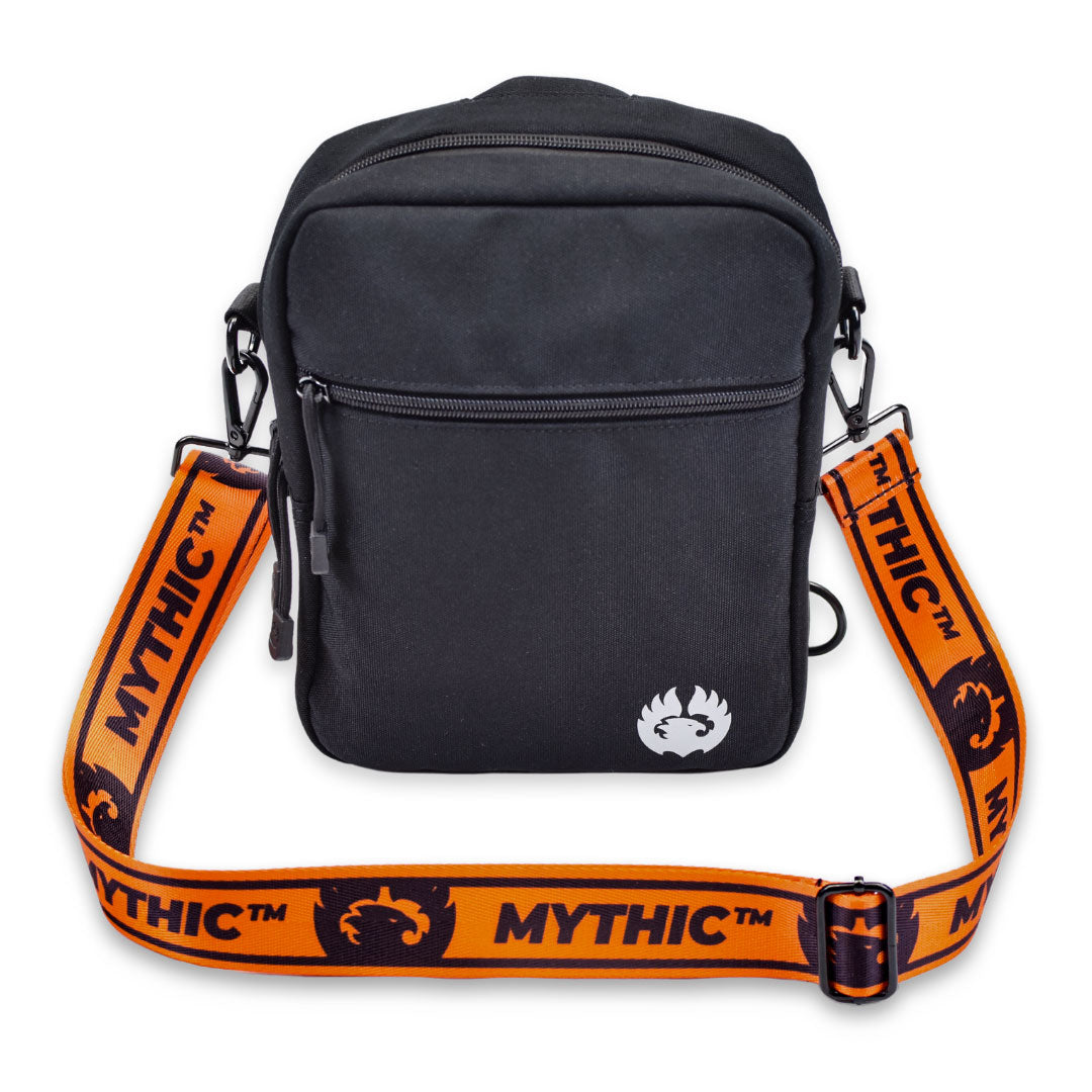 MYTHIC Logo Adjustable Shoulder Strap in orange connected to black crossbody pack for hands-free convenience.