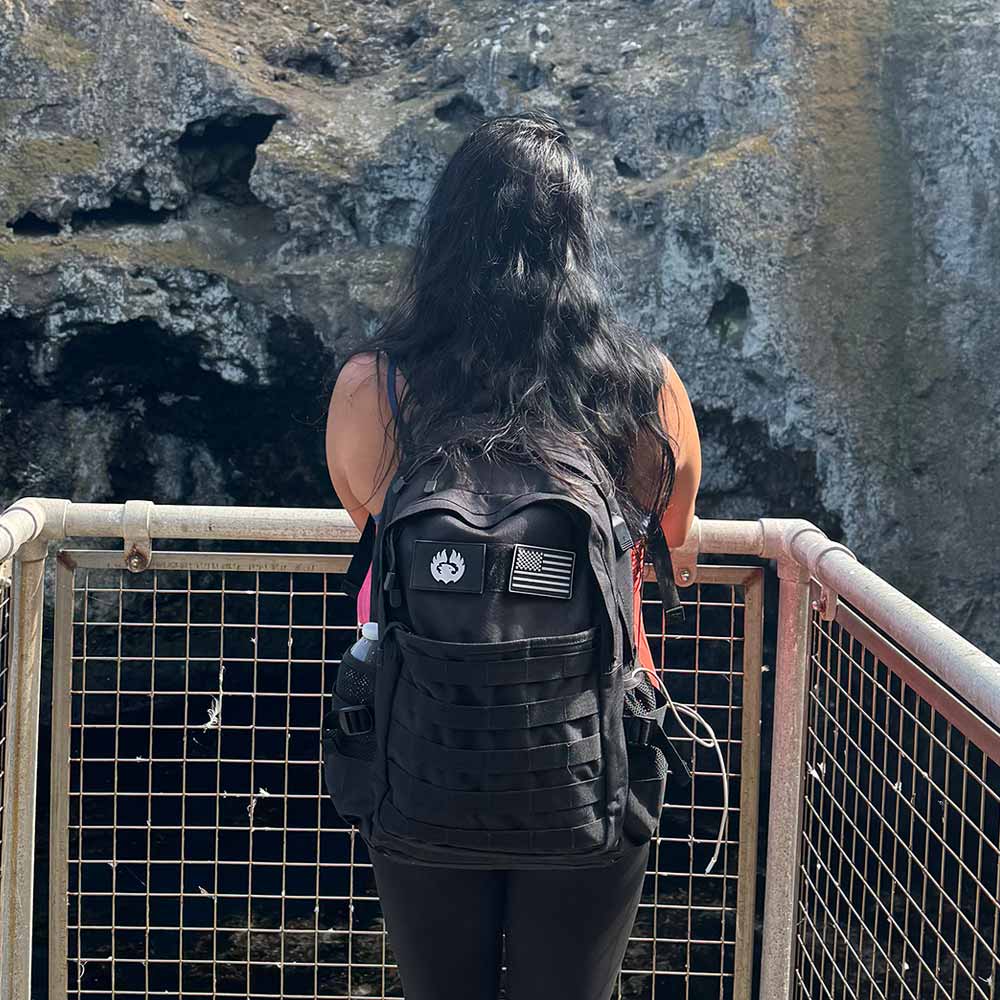 TORCH EDC 30L Backpack black worn in outdoor environment used for hiking, commuting, and travel gear.