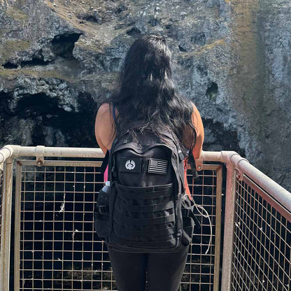 TORCH EDC 30L Backpack black worn in outdoor environment used for hiking, commuting, and travel gear.